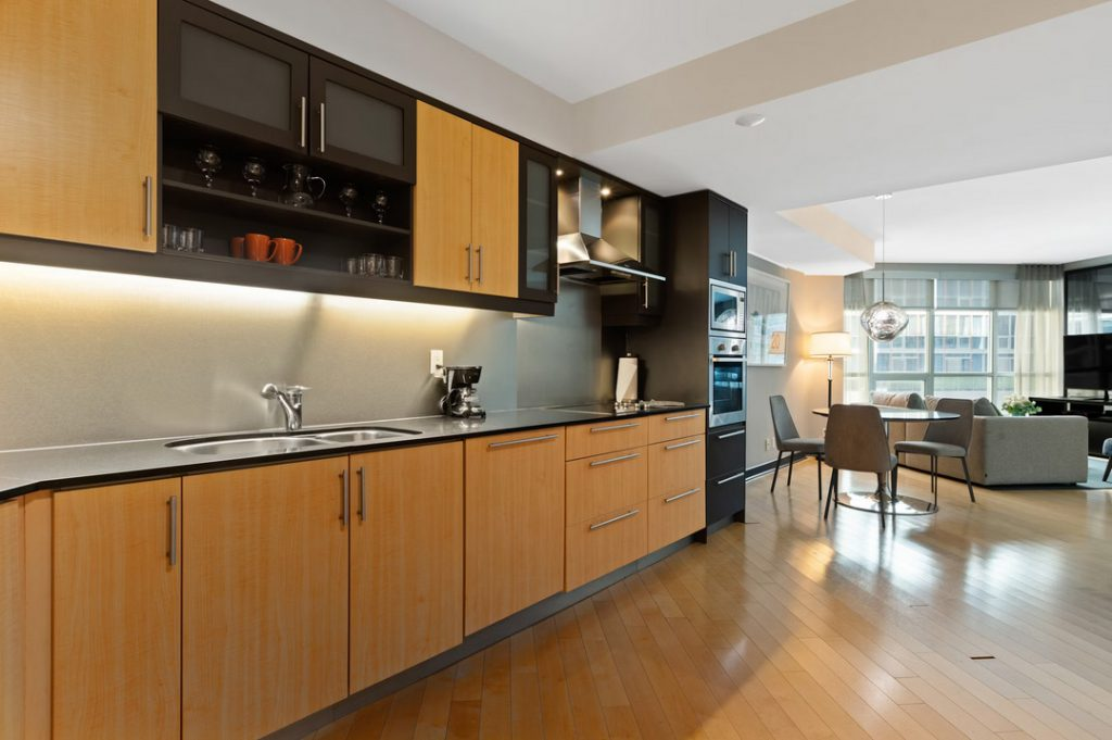Modern galley kitchen with maple and dark cabinetry