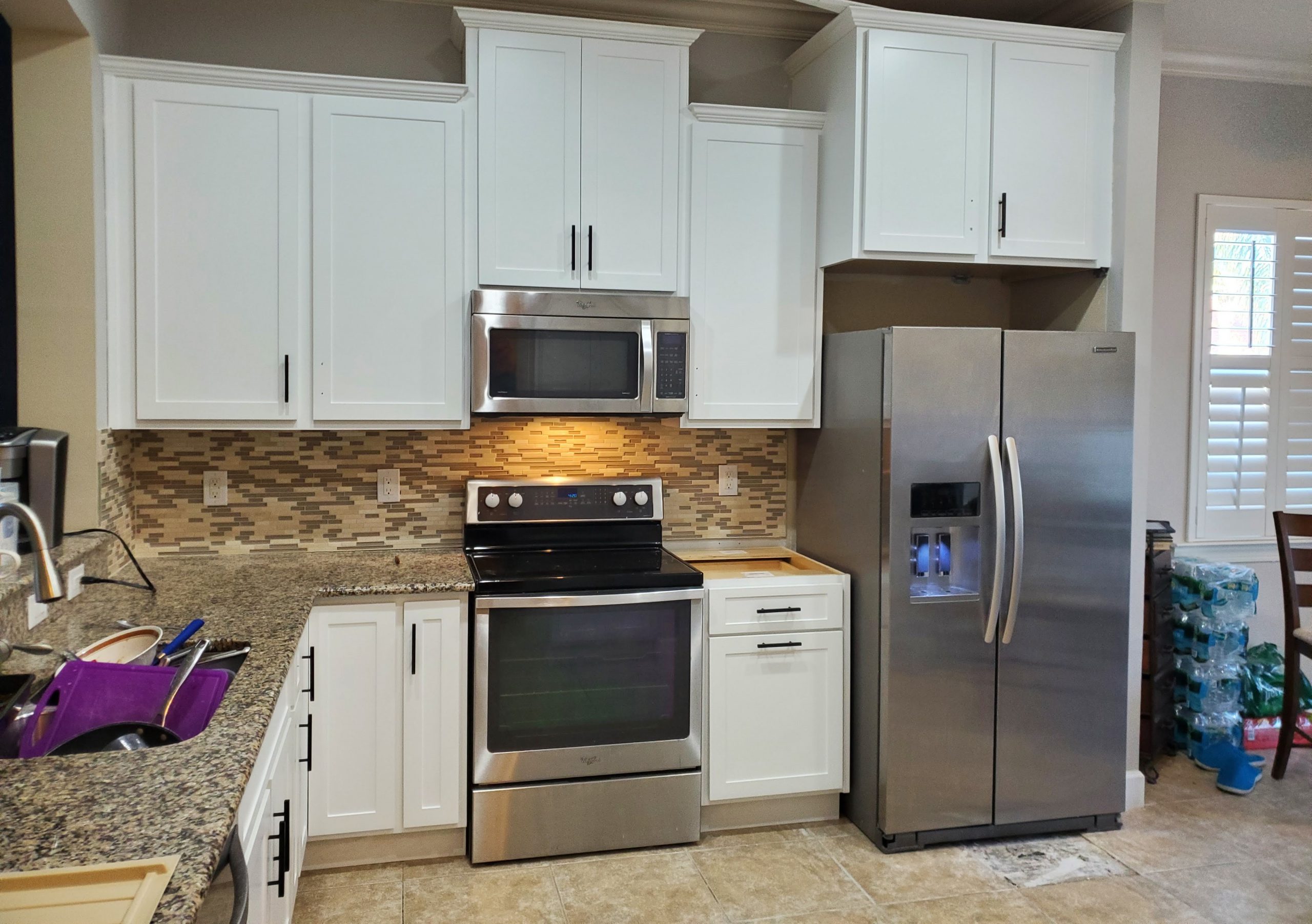 Refaced white cabinet doors and drawer fronts